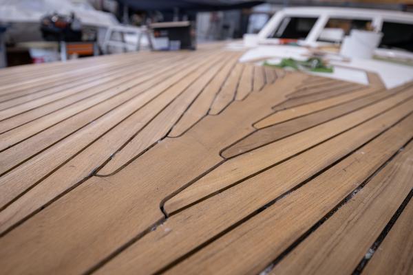Teak is mounted by hand on the Nordship 570 DS deck